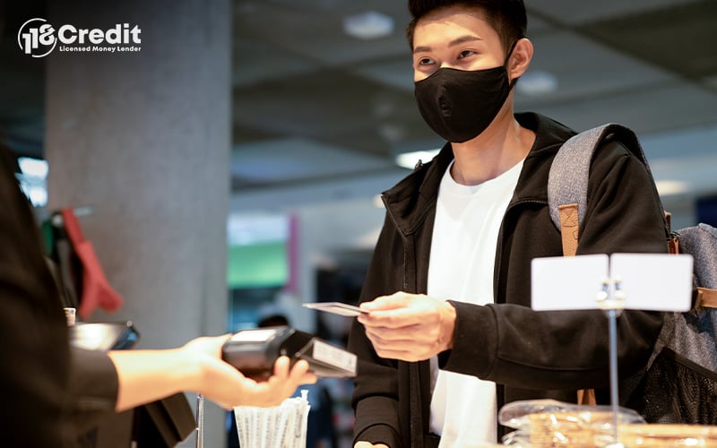 Man making a credit card payment at a store