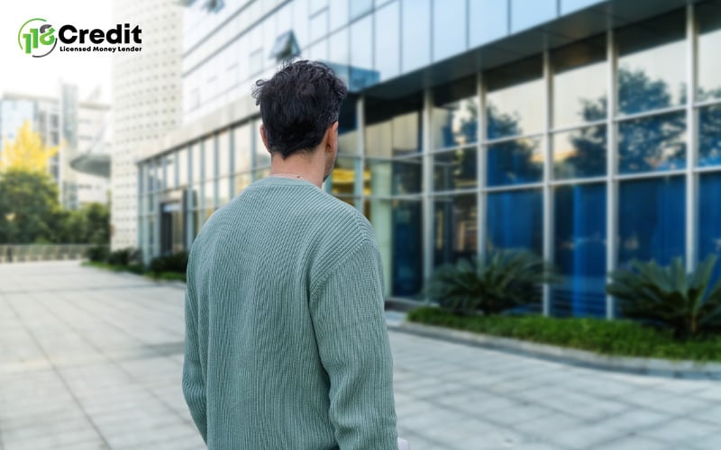 Man walking into a bank.