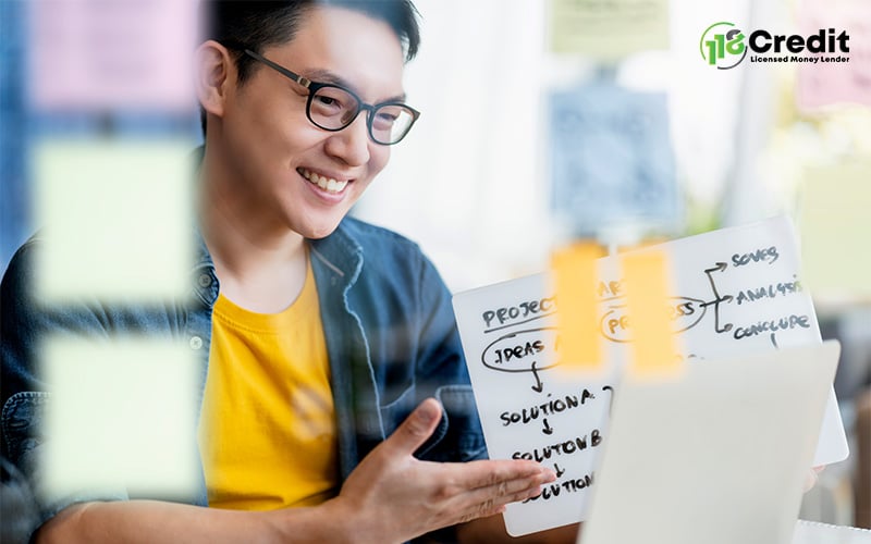 Man presenting ideas online, demonstrating skills upgrading benefits.