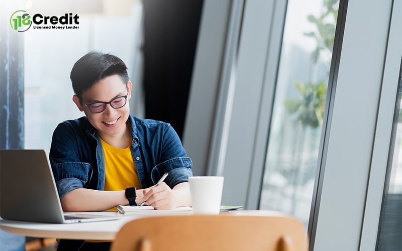 Young professional investing in self by taking notes for skills upgrade.