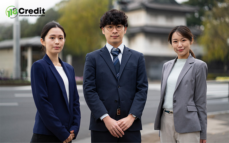 Asian financial professionals respecting cultural traditions in Singapore lending.