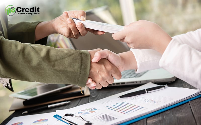 Shaking hands to symbolize trust in traditional money lending.