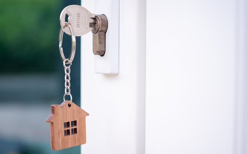 Key in door lock securing rental property after deposit payment.